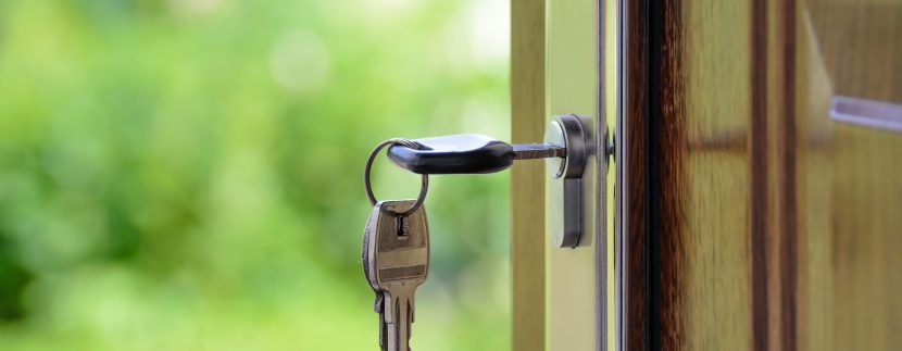 Real estate appraisal close up front door with key